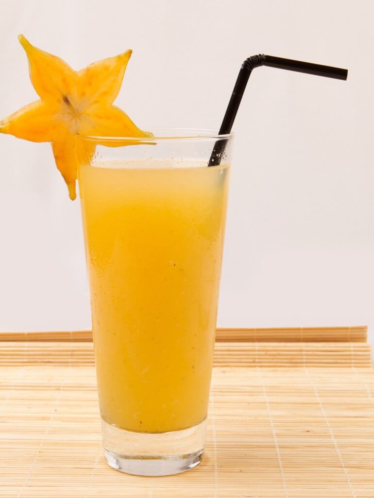Starfruit juice with a sliced starfruit as glass design